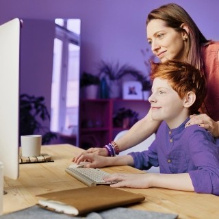 Image of mother and son using computer