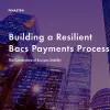 Image of laptop with cover slider of "Building a resilient Bacs payments process: The cornerstone of business stability" eBook